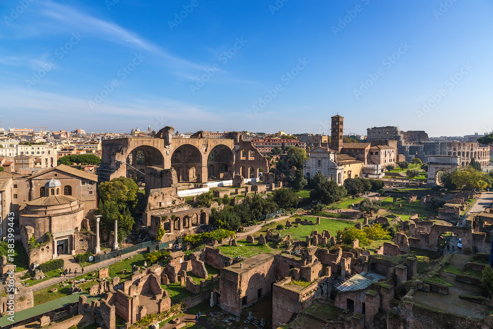 Rome, Italy. The ruins of the Roman Forum: Romulus Temple, church of Santi Cosma e Damiano, Basilica of Maxentius,  Church of Santa Francesca Romana,  Colosseum