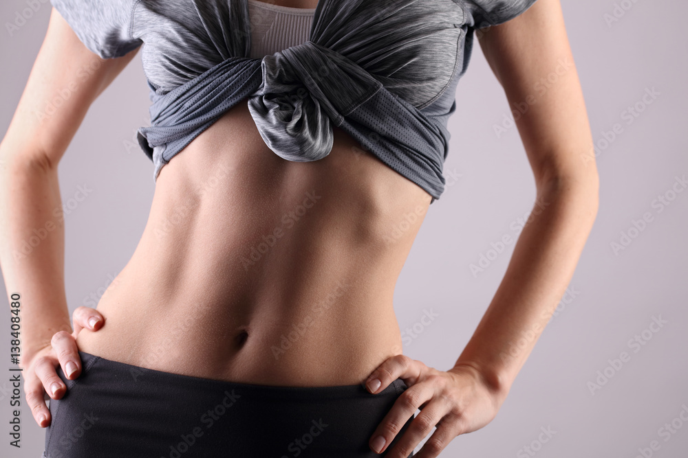 Foto Stock Sport, fitness, Dieting results, Healthy woman body, waistline.  Slim female torso, waist, belly, abdomen close up. | Adobe Stock
