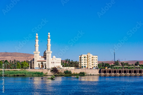 The El-Tabia Mosque in Aswan, Egypt. Egyptian Mosque Minarets. Aswan Mosque along the Nile River with two minarets. © EwaStudio