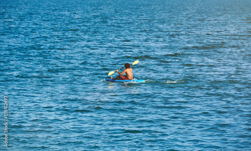 One man on blue kayak