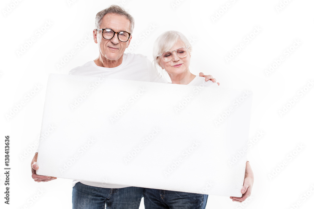 Senior beautiful couple with empty white board. Senior beautiful couple with empty white board.
