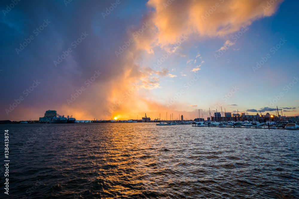 Dramatic sunset over the Patapsco River, at the Canton Waterfront, in Baltimore, Maryland.