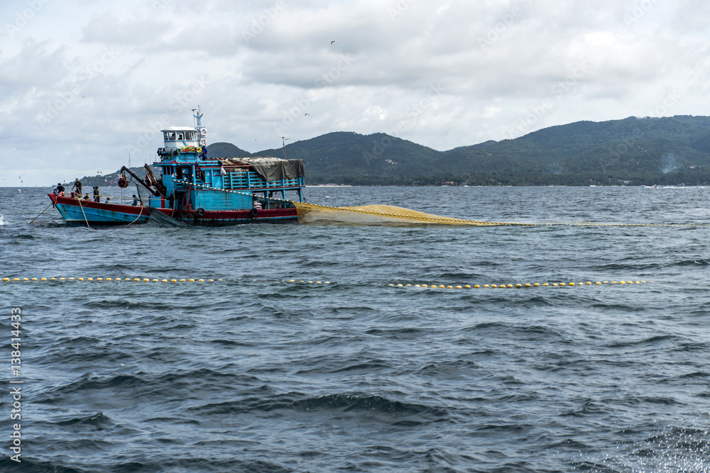 Fishing boat big fishermen with fish net on the blue ocean catch fish Fishing boat big fishermen with fish net on the blue ocean catch fish