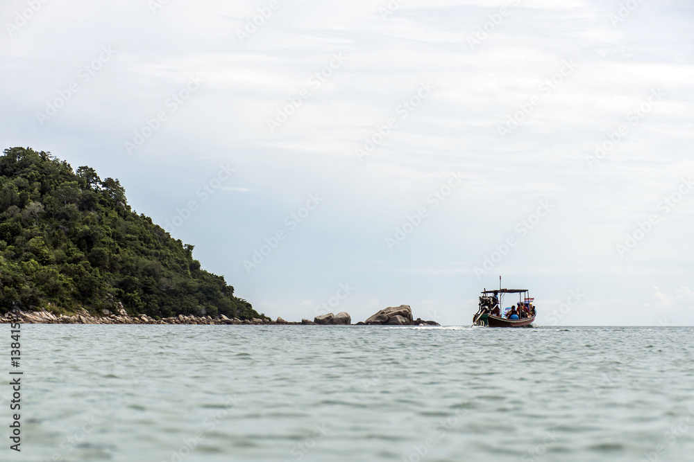 Thai traditional longtail boat tour big diesel engine in action smoke pollution