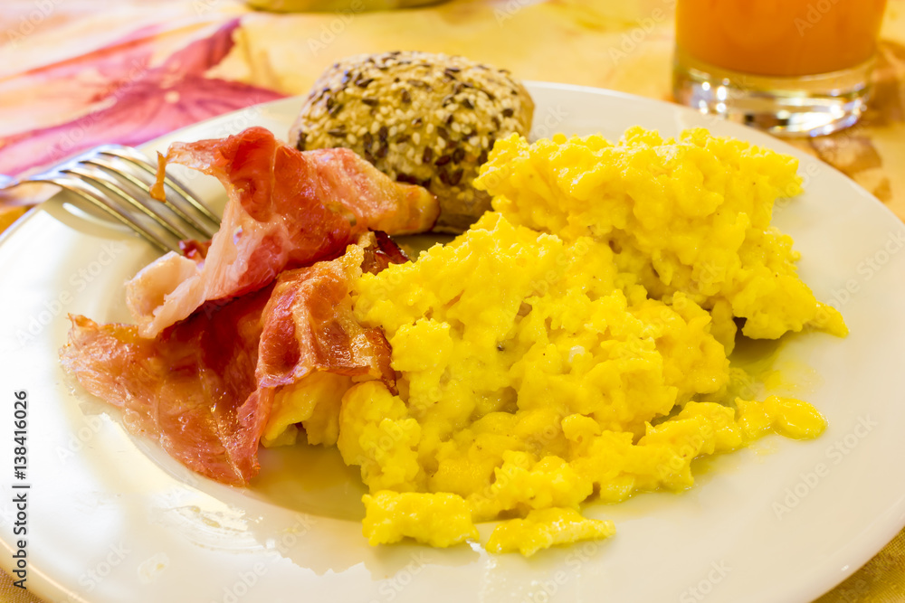 Scrambled eggs with bacon and bread with seeds Scrambled eggs with bacon and bread with seeds