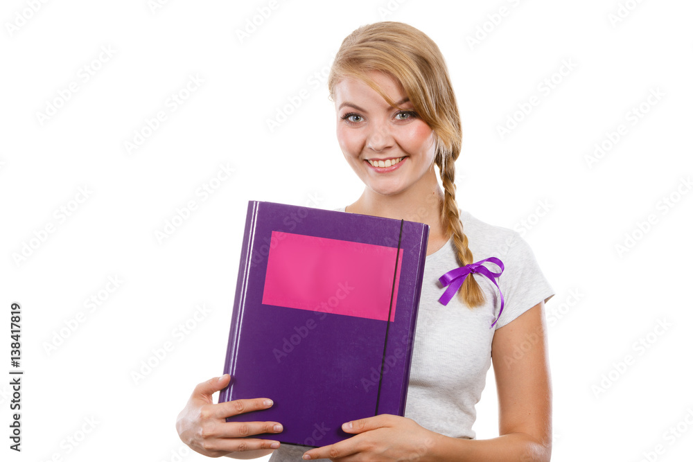 Young teenage student with braid holding books Young teenage student with braid holding books