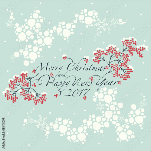 Bunches of red Rowan,the pattern of the snow globe and the phrase merry christmas and happy new year on the blue background. 