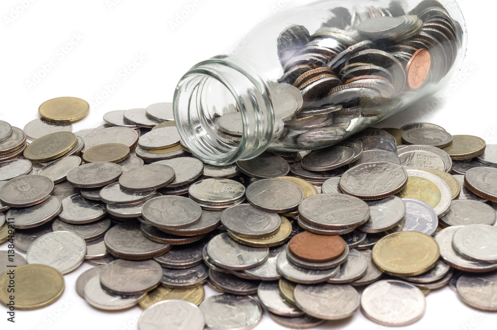 Saving money concept of collecting coins in glass bottle Isolated on white background. Saving money concept of collecting coins in glass bottle Isolated on white background.