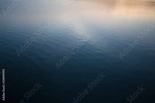 Blurred image of sea water background © akkalak