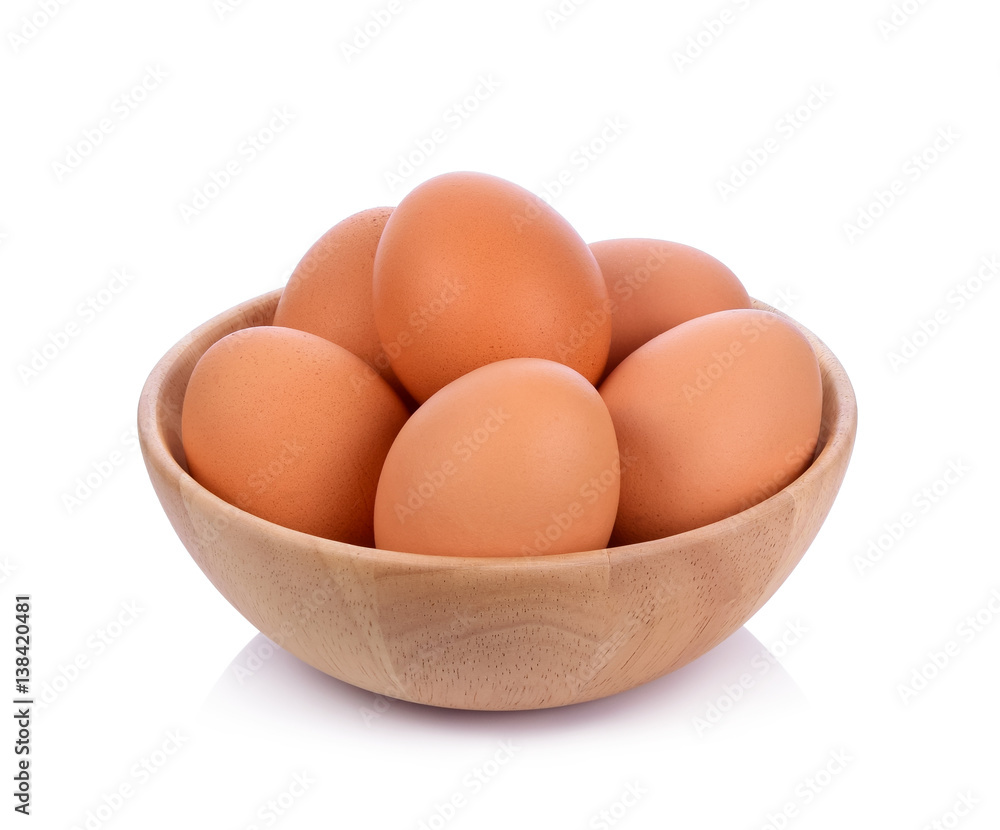 Eggs in wooden bowl isolated on white background Eggs in wooden bowl isolated on white background