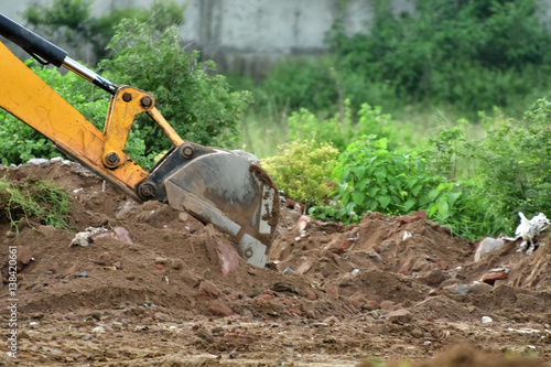 Wallpaper Mural Excavator is working with dusty red soil. Torontodigital.ca