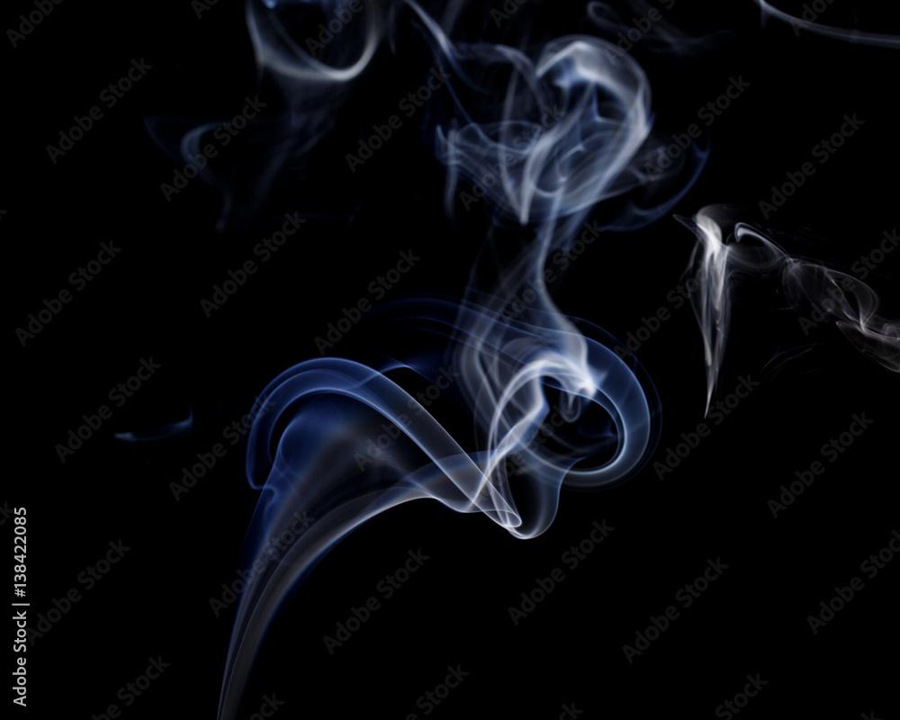 Abstract art. Color white blue smoke from the aromatic sticks on a black background. Background for Halloween. Texture fog. Design element. The concept of aromatherapy. Abstract art. Color white blue smoke from the aromatic sticks on a black background. Background for Halloween. Texture fog. Design element. The concept of aromatherapy.