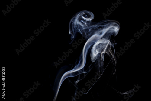Fototapeta Naklejka Na Ścianę i Meble -  Abstract art. Color white blue smoke from the aromatic sticks on a black background. Background for Halloween. Texture fog. Design element. The concept of aromatherapy.
