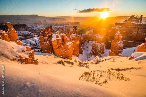 Hoodoos and Trails Covered in Snow on a Cold Winter Morning Sunrise in Bryce Canyon National Park, Utah