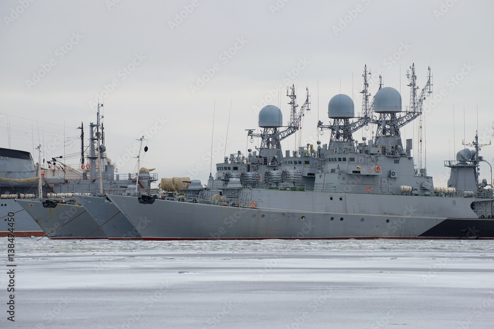 Three small anti-submarine ship of the Baltic Navy on the winter Park, cloudy January day.  Kronshtad