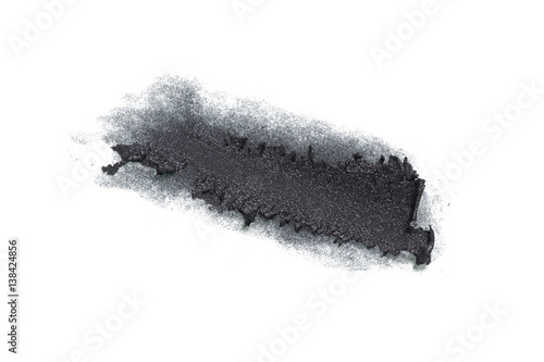 Smudged black color cosmetic on background