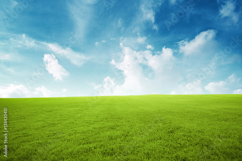 Green field under blue sky with many cloud Beauty nature background