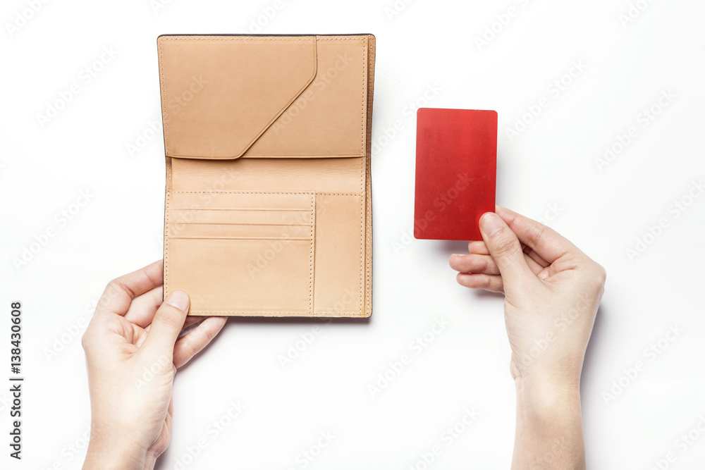 woman hand hold a brown leather wallet with name card or credit card isolated white. woman hand hold a brown leather wallet with name card or credit card isolated white.