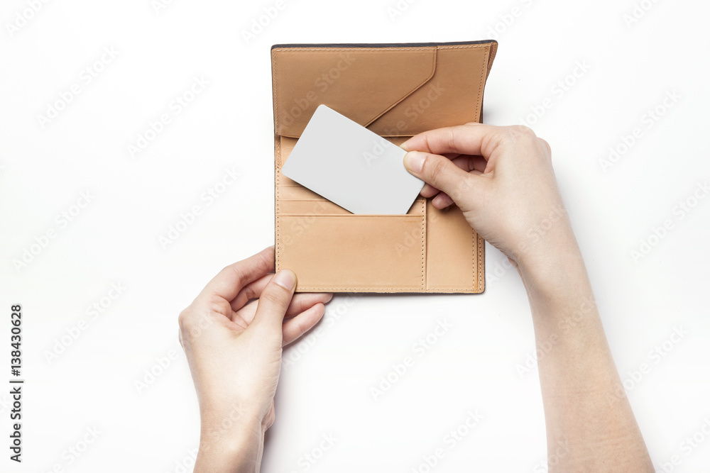 woman hand hold a brown leather wallet with name card or credit card isolated white. woman hand hold a brown leather wallet with name card or credit card isolated white.