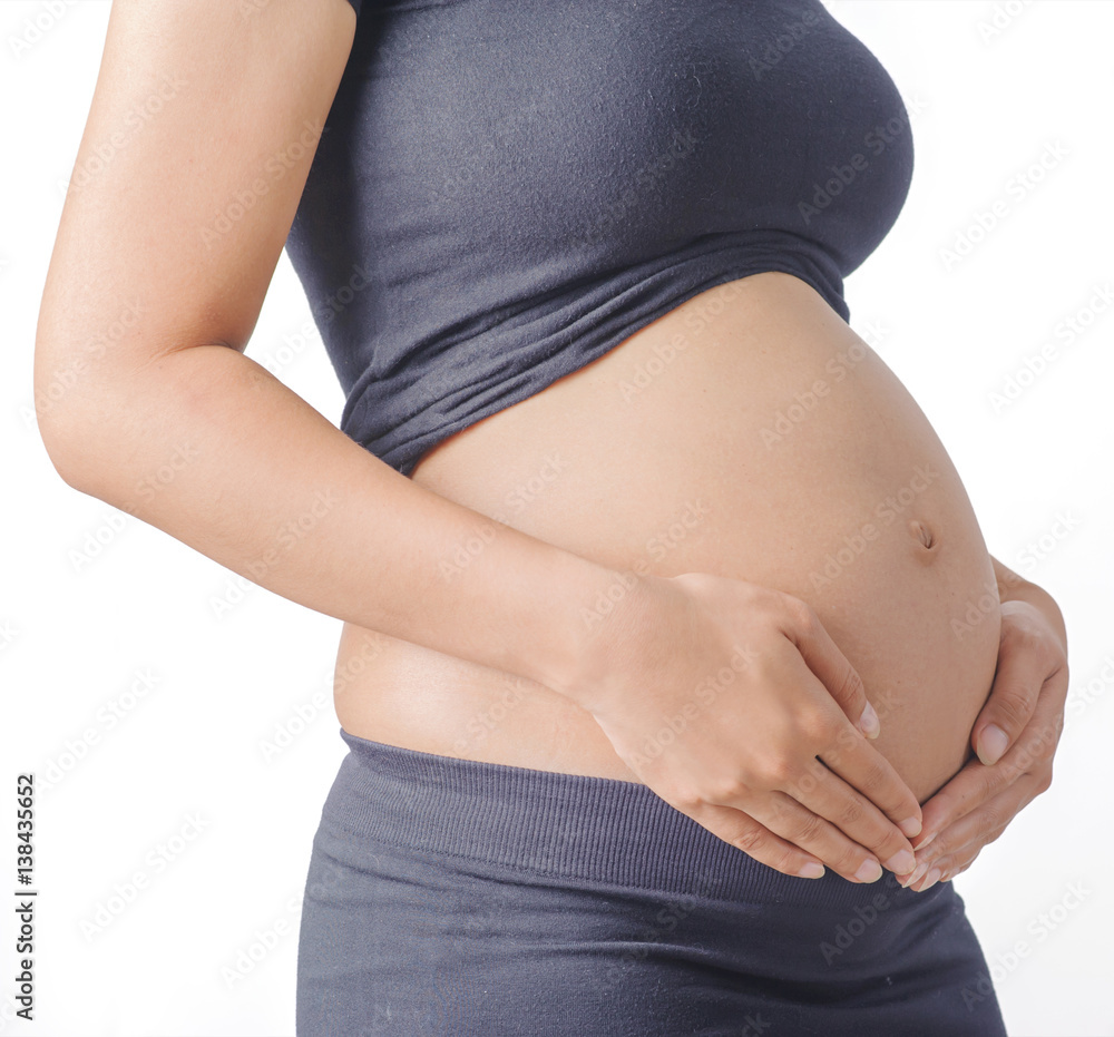 Beautiful Belly of a pregnant woman on white background. Beautiful Belly of a pregnant woman on white background.