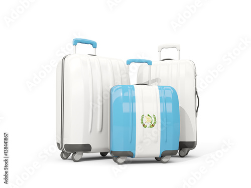 Luggage with flag of guatemala. Three bags isolated on white