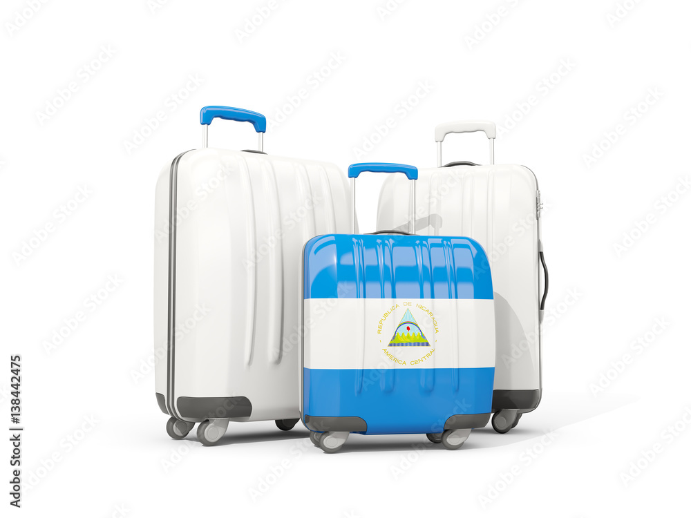 Obraz premium Luggage with flag of nicaragua. Three bags isolated on white