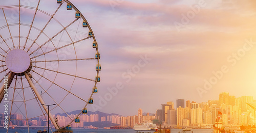 Photography The popular icon Observation Wheel in Hong Kong island at sunset near Ferry Pier arera with landmark buildings in background