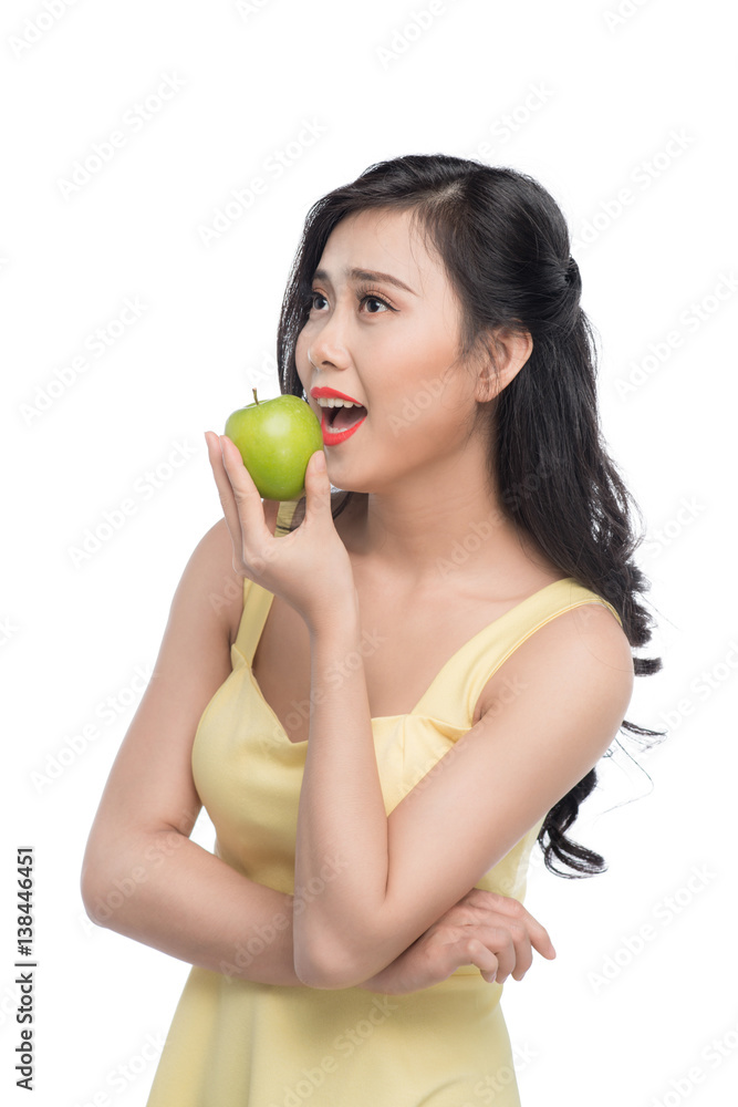 Pretty young asian woman holding fresh apple isolated on white background. Pretty young asian woman holding fresh apple isolated on white background.