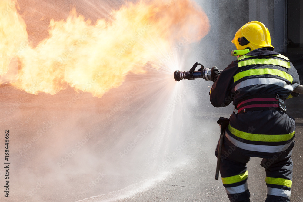 Naklejka premium Firefighter in action