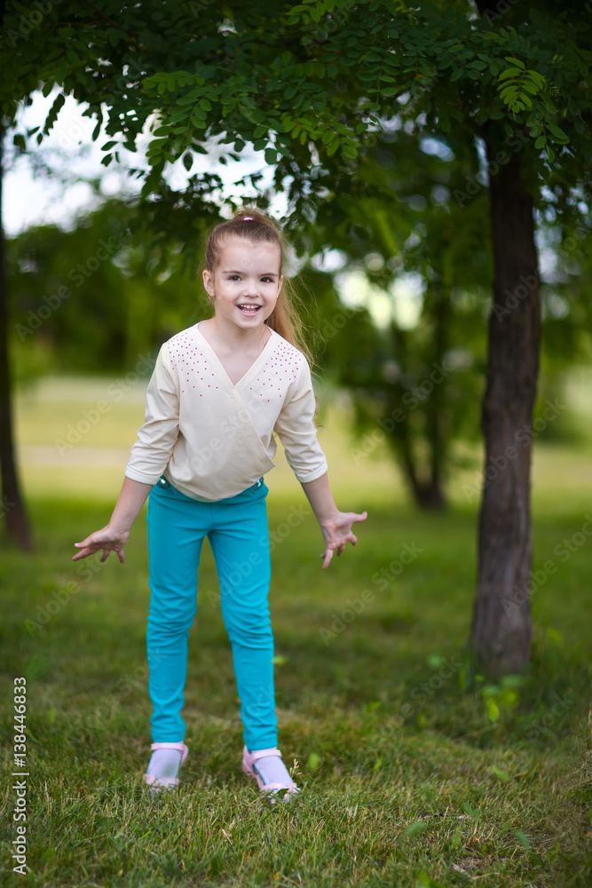 child standing near tree