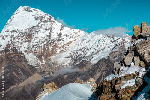 High Altitude Mountains Landscape Rock Snow and majestic Summit photo