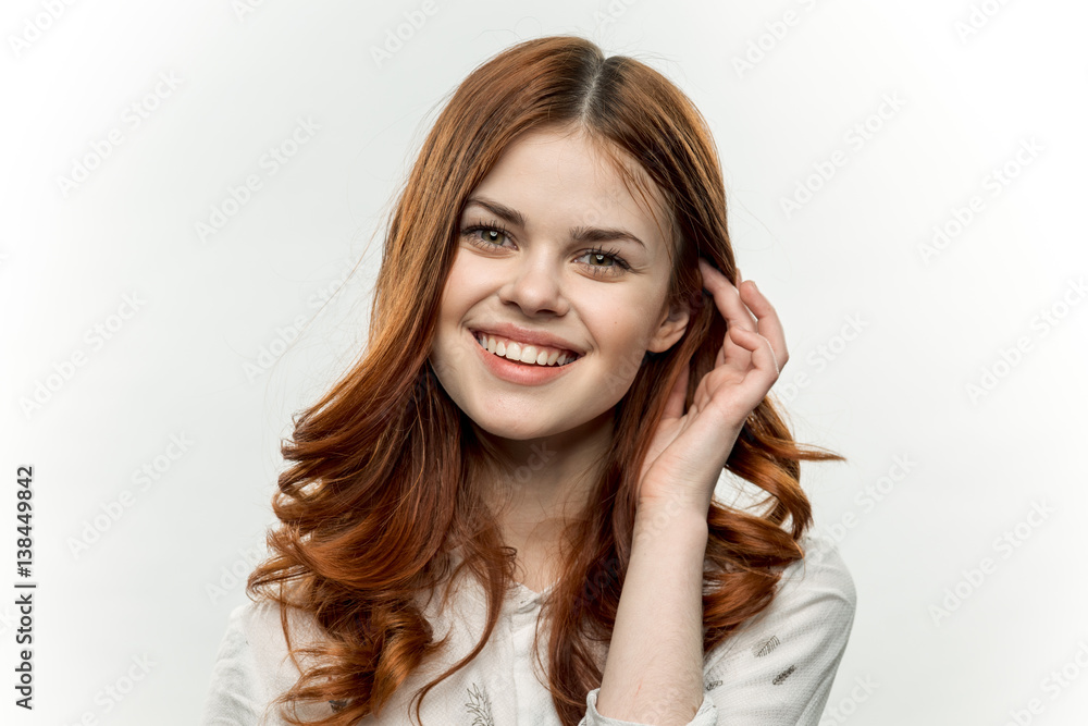 happy woman takes hair from face
