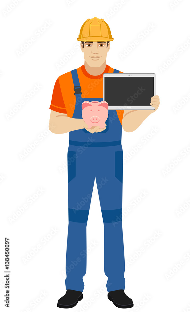 Builder holding piggy bank and digital tablet Builder holding piggy bank and digital tablet