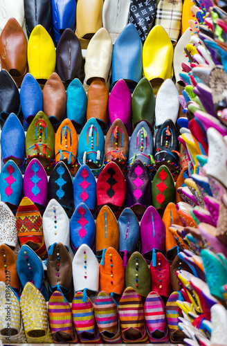 Colors of Marrakesh on sophisticated handmade slippers at medina souk, Morocco