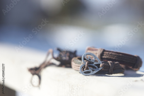 symbol of love - two leather bracelet with metal heart
