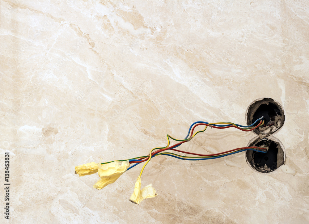 Finishing works at renovated apartment. Electrical wiring installation
