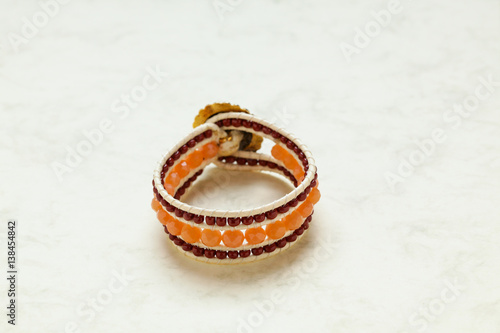Handmade bracelet close up at marble stone pattern cardboard; no people, 