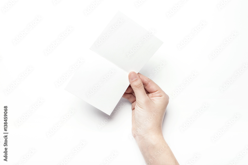 woman hand hold a empty post card isolated white. woman hand hold a empty post card isolated white.