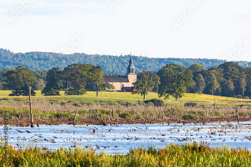 Bjurum church at lake Hornborgasjon, Sweden photo