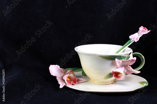 Slika na platnu porcelain cup of tea with a lily