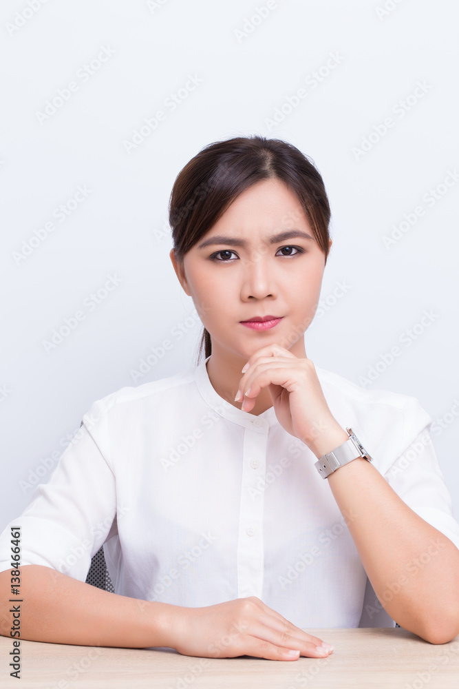 Asian woman thinking on isolated background Asian woman thinking on isolated background