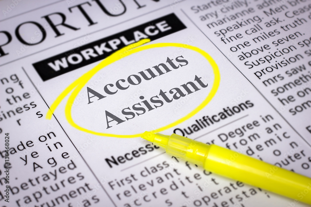 Fototapeta premium Accounts Assistant - Newspaper sheet with ads and job search, circled with yellow marker, Blurred image and selective focus