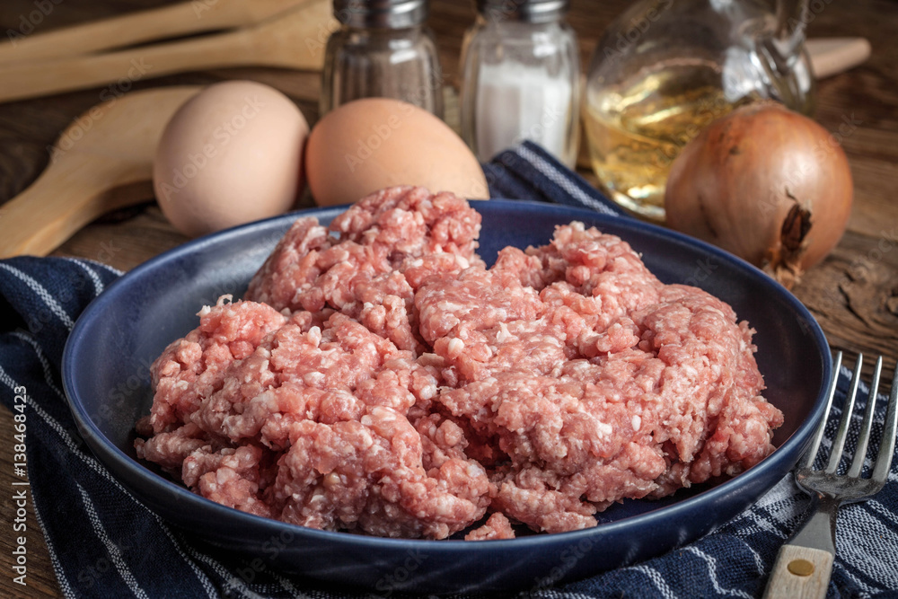Minced meat on wooden background. Minced meat on wooden background.