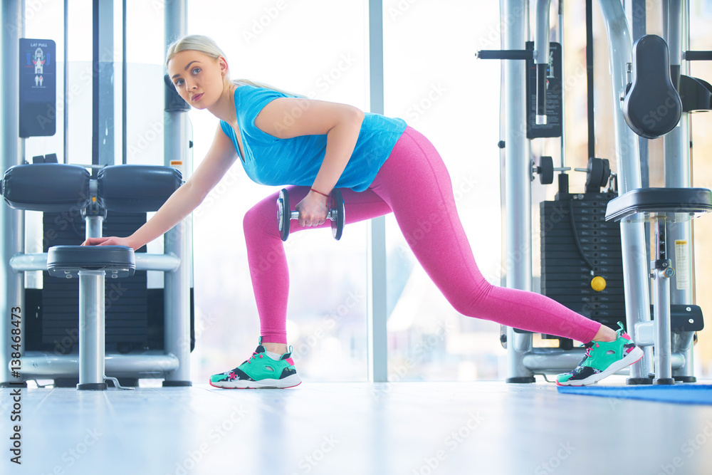 Fototapeta premium exercising with barbell in gym