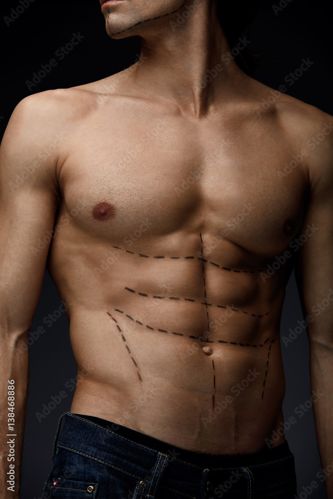 Closeup Of Man With Sexy Fit Body And Black Lines On Skin