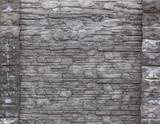 The blocks of solid stone.The wall of gray stone.Vintage rustic weathered uneven background.