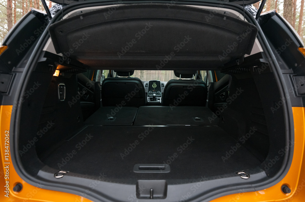Empty car (minivan) trunk with folded rear seats. A lot of space.