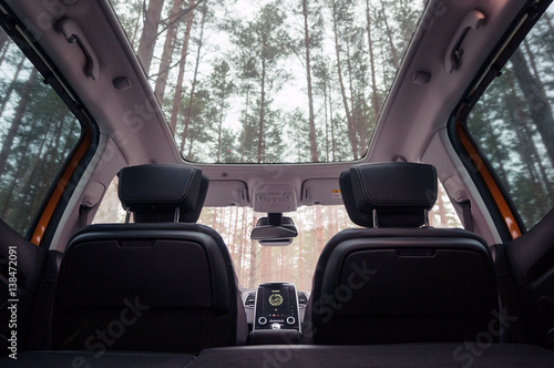 Panoramic roof, dashboard. The view from the empty car trunk with folded rear seats.