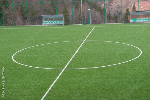 corner in the football field with artificial turf flag