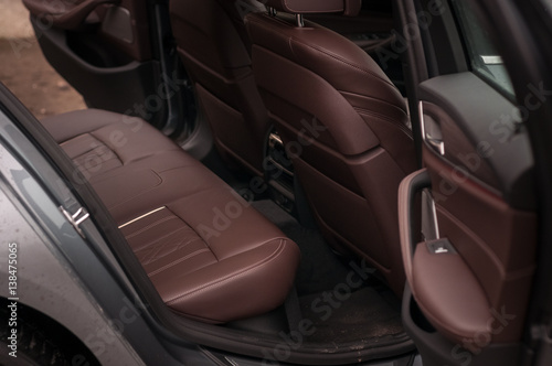 Rear leather seats in the luxury car. © vpilkauskas